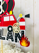 Load image into Gallery viewer, firefighter firetruck cake topper featuring fireman emblem, fire truck, fire hose, flame, fire hydrant, dalmatian and fire extinguisher