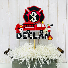 Load image into Gallery viewer, firefighter firetruck cake topper featuring fireman emblem, fire truck, fire hose, flame, fire hydrant, dalmatian and fire extinguisher