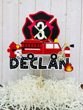 Load image into Gallery viewer, firefighter firetruck cake topper featuring fireman emblem, fire truck, fire hose, flame, fire hydrant, dalmatian and fire extinguisher