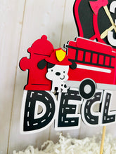 Load image into Gallery viewer, firefighter firetruck cake topper featuring fireman emblem, fire truck, fire hose, flame, fire hydrant, dalmatian and fire extinguisher