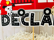 Load image into Gallery viewer, firefighter firetruck cake topper featuring fireman emblem, fire truck, fire hose, flame, fire hydrant, dalmatian and fire extinguisher