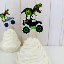 Load image into Gallery viewer, Monster jam inspired monster trucks with a T-Rex dinosaur cupcake toppers. Each monster truck features a T-Rex standing on the back of the truck. The monster truck dinosaur cupcake toppers are professionally printed, cut and attached to four inch bamboo skewers. The monster truck dinosaur cupcake toppers are handcrafted in the USA. The truck options are Grave Digger, Megaladon, El Toro Loco, Tornado and Dragon.