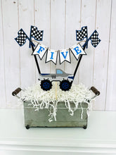Load image into Gallery viewer, Monster Jam inspired monster truck cake topper bunting. The cake toppers feature two checkered flags, pennant flags that read either an age, name or word. Each cake topper includes a coordinating monster jam inspired truck.