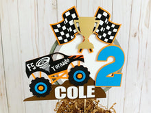 Load image into Gallery viewer, Monster Jam inspired monster truck cake topper. The cake topper features a monster jam inspired monster truck on a dirt mound, a checkered flag, tropy and number. The cake topper is also personalizable with your child's name. The truck options are Grave Digger, Megaladon, El Toro Loco, Tornado and Dragon.