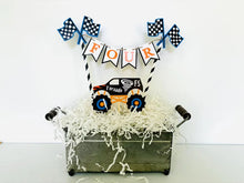 Load image into Gallery viewer, Monster Jam inspired monster truck cake topper bunting. The cake toppers feature two checkered flags, pennant flags that read either an age, name or word. Each cake topper includes a coordinating monster jam inspired truck.