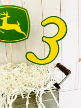 Load image into Gallery viewer, Green tractor birthday table decor or cake topper decorations. The set includes a green open cab tractor, number and deer sign. The items are attached to 6" bamboo skewers.