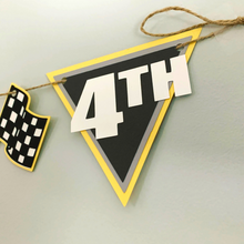 Load image into Gallery viewer, Monster Jam inspired monster truck happy birthday banner. The banner features monster jam logo inspired triangle pennants, a checkered flag, Grave Digger, Megladon, Tornado, El Toro Loco and Dragon monster trucks.