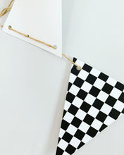 Load image into Gallery viewer, This checkered flag pennant banner can be used in so many different ways and for so many different themes! From a two fast or fast one racing themed birthday party to monster trucks or dirt bikes, this checkered flag pennant banner is the perfect size to adorn your refreshments table, hanging with a balloon garland to make that perfect photo backdrop or hanging overhead for extra fun. After the party, hang it in your little one's bedroom or playroom!