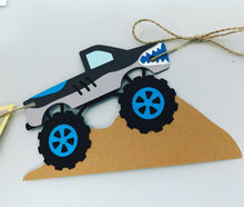 Load image into Gallery viewer, Monster Jam inspired monster truck happy birthday banner. The banner features monster jam logo inspired triangle pennants, a checkered flag, Grave Digger, Megladon, Tornado, El Toro Loco and Dragon monster trucks.