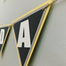 Load image into Gallery viewer, Monster Jam inspired monster truck happy birthday banner. The banner features monster jam logo inspired triangle pennants, a checkered flag, Grave Digger, Megladon, Tornado, El Toro Loco and Dragon monster trucks.