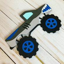 Load image into Gallery viewer, Monster Jam inspired monster truck cutouts handcrafted by Declan & Smith Party Decor. The trucks are cut from cardstock and assembled by hand. The truck cutouts are avaiable with or without the skewer and can be used in a variety of ways for your monster jam monster truck party.