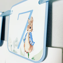 Load image into Gallery viewer, Peter Rabbit Photo Banner that includes months NB - 12. Each pennant features watercolor floral images. Alternating months also includes a Peter Rabbit Image.