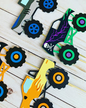 Load image into Gallery viewer, Monster Jam inspired monster truck cutouts handcrafted by Declan & Smith Party Decor. The trucks are cut from cardstock and assembled by hand. The truck cutouts are avaiable with or without the skewer and can be used in a variety of ways for your monster jam monster truck party.
