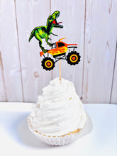 Load image into Gallery viewer, Monster jam inspired monster trucks with a T-Rex dinosaur cupcake toppers. Each monster truck features a T-Rex standing on the back of the truck. The monster truck dinosaur cupcake toppers are professionally printed, cut and attached to four inch bamboo skewers. The monster truck dinosaur cupcake toppers are handcrafted in the USA. The truck options are Grave Digger, Megaladon, El Toro Loco, Tornado and Dragon. 
