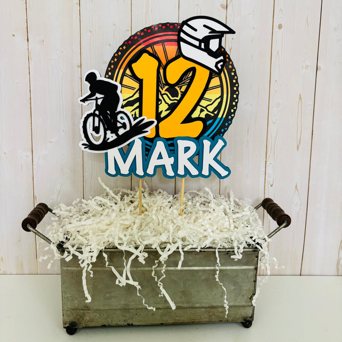 Mountain bike cake topper featuring MTB bike and rider, full face helmet, name, age, bicycle tire and wheel spokes