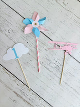 Load image into Gallery viewer, pink airplane centerpiece with a pink airplane, pink and blue pinwheel and white cloud with a blue number one
