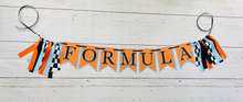 Load image into Gallery viewer, McLaren Formula One racing inspired birthday banner featuring blue orange and black and checkered flag fabric
