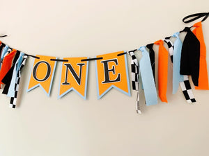 McLaren Formula One racing inspired birthday banner featuring blue orange and black and checkered flag fabric