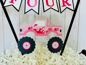 Pink monster truck cake topper. The cake topper is customizable and can display an age, name, word or phrase. The colors are also customizable. The pink monster truck cake topper features two checkered flags, pennant banner and a monster truck to display underneath the bunting. The pink monster truck cake topper is designed and handcrafted by Laura, the owner of Declan & Smith Party Decor. 