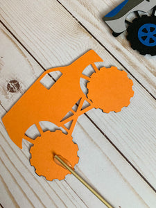 Monster Jam inspired monster truck cutouts handcrafted by Declan & Smith Party Decor. The trucks are cut from cardstock and assembled by hand. The truck cutouts are avaiable with or without the skewer and can be used in a variety of ways for your monster jam monster truck party. 